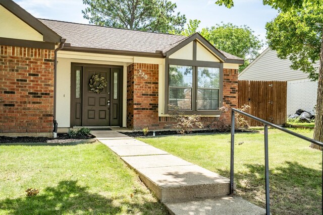 220 Timber Ridge Ln, Coppell, TX 75019 - doorway to property with brick siding