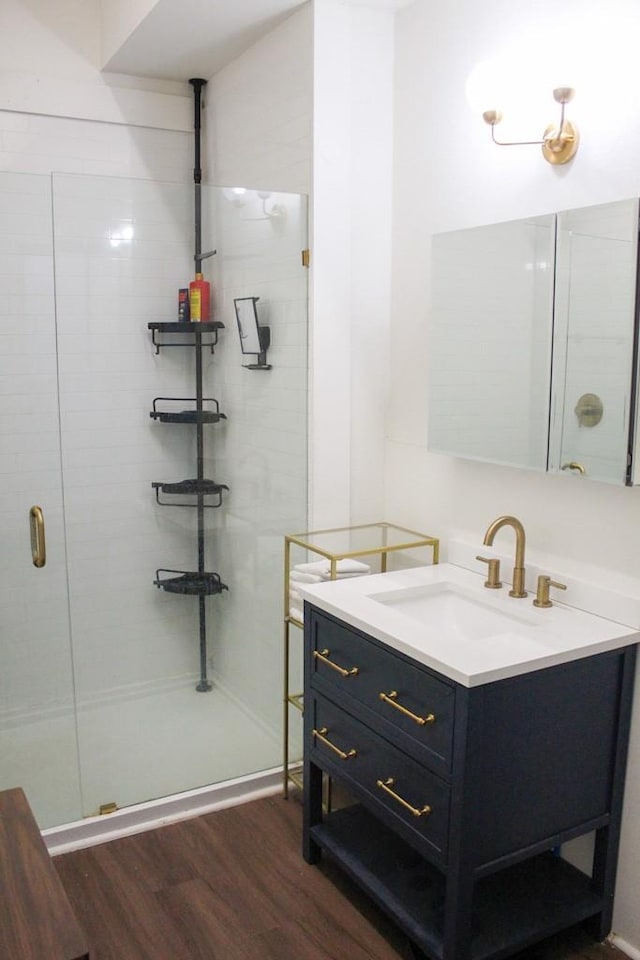 610 W 6th, Cisco, TX 76437 - full bath featuring wood finished floors, vanity, and a shower stall