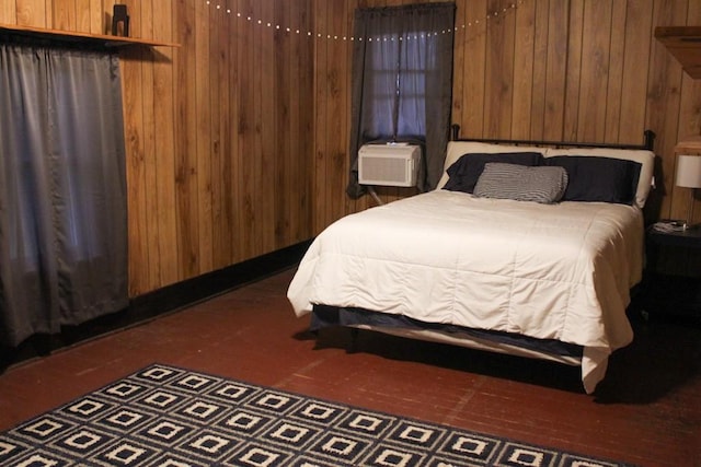 610 W 6th, Cisco, TX 76437 - bedroom featuring wooden walls, cooling unit, and carpet floors