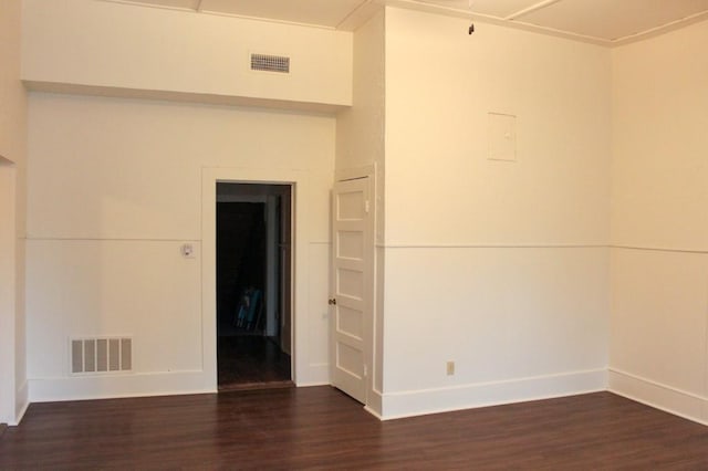 610 W 6th, Cisco, TX 76437 - empty room with dark wood-style flooring and baseboards