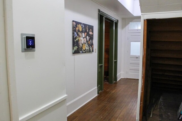 610 W 6th, Cisco, TX 76437 - hall featuring dark wood-style flooring and baseboards