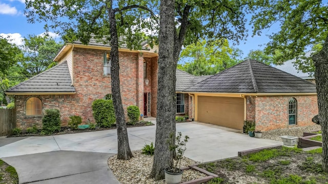 120 Oak Hollow Ct S, Azle, TX 76020 - view of front facade featuring brick siding, driveway, and a garage