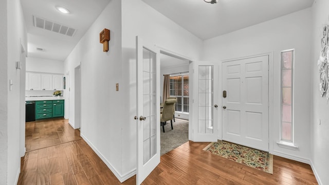 120 Oak Hollow Ct S, Azle, TX 76020 - entrance foyer featuring wood finished floors, baseboards, and french doors
