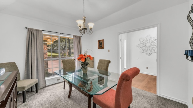 120 Oak Hollow Ct S, Azle, TX 76020 - dining room featuring a chandelier, wood finished floors, and baseboards