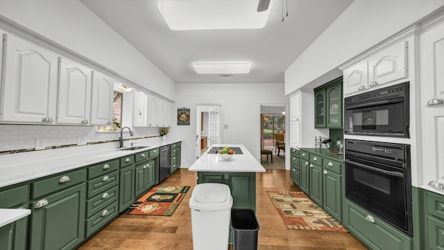 120 Oak Hollow Ct S, Azle, TX 76020 - kitchen with green cabinetry, a sink, white cabinets, and wood finished floors