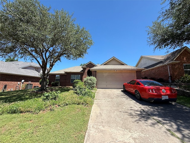 2801 Hereford Rd, Denton, TX 76210 - single story home with an attached garage, brick siding, concrete driveway, and a front yard