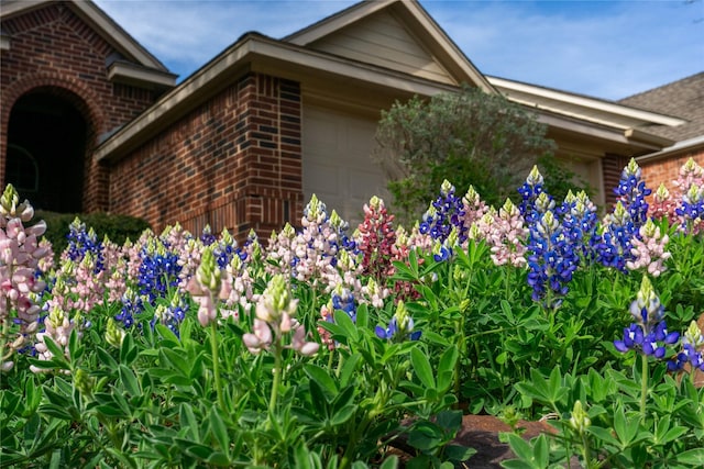 2801 Hereford Rd, Denton, TX 76210 - view of home's exterior with brick siding and an attached garage
