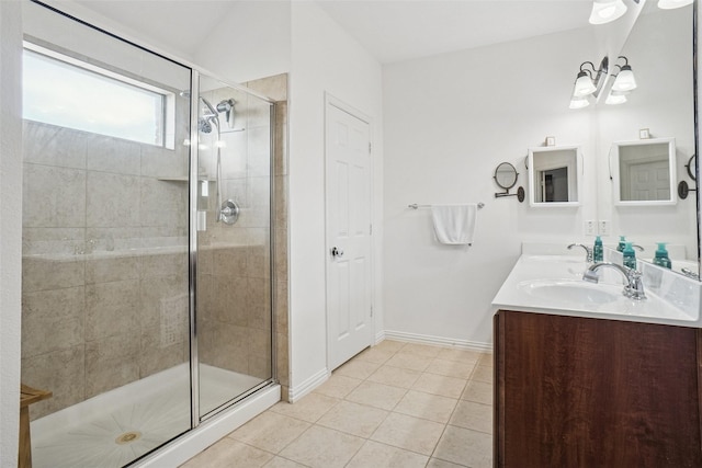 4028 Burwood Dr, Fort Worth, TX 76262 - bathroom featuring tile patterned flooring, double vanity, a shower stall, and baseboards