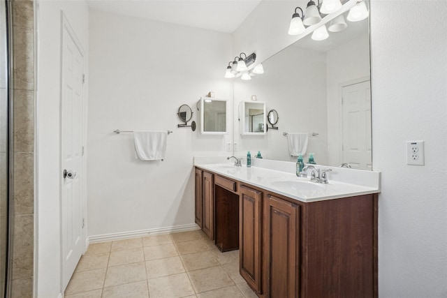 4028 Burwood Dr, Fort Worth, TX 76262 - full bath featuring double vanity, tile patterned floors, baseboards, and a chandelier