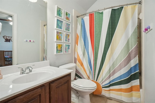 4028 Burwood Dr, Fort Worth, TX 76262 - bathroom with vanity, toilet, tile patterned flooring, vaulted ceiling, and shower / tub combo with curtain