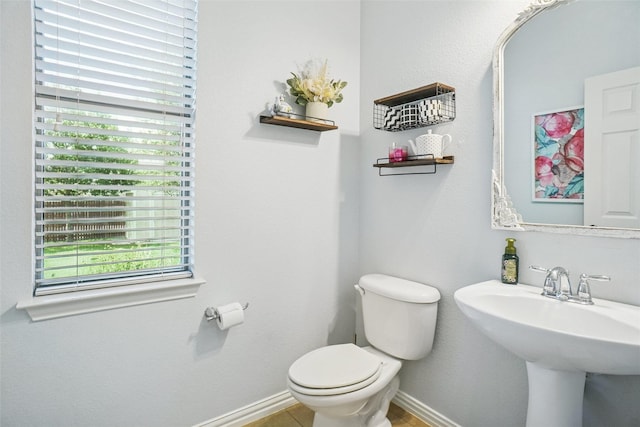 4028 Burwood Dr, Fort Worth, TX 76262 - bathroom with toilet, a sink, and baseboards