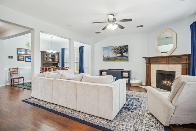 4028 Burwood Dr, Fort Worth, TX 76262 - living room with wood-type flooring, ceiling fan, a chandelier, a fireplace, and crown molding