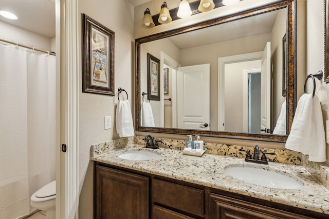 4328 Waterstone Rd, Fort Worth, TX 76244 - bathroom featuring double vanity, toilet, and a shower with curtain
