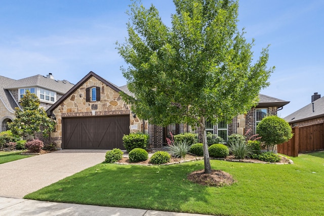 4328 Waterstone Rd, Fort Worth, TX 76244 - view of front facade featuring stone siding, a garage, and concrete driveway