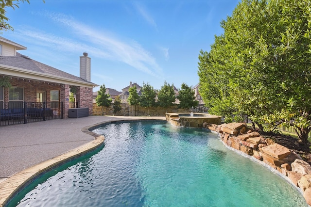 128 Brown Knight Ln, Lewisville, TX 75056 - view of swimming pool featuring a fenced backyard, a patio, and a pool with connected hot tub
