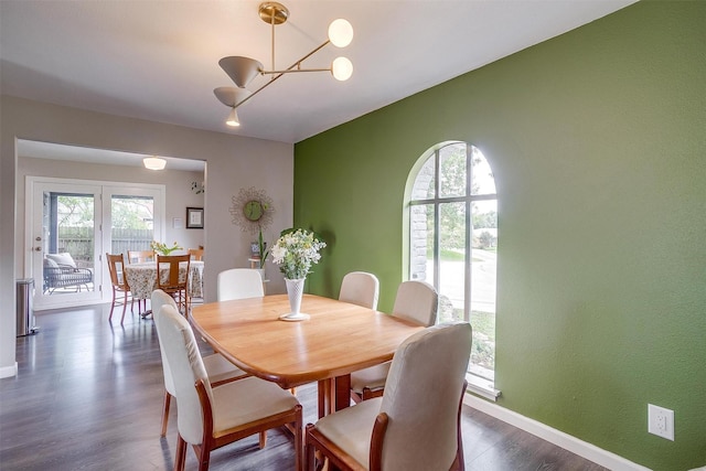 6325 Wallingford Dr, Fort Worth, TX 76133 - dining space featuring a chandelier, dark wood-style flooring, and baseboards