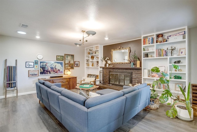6325 Wallingford Dr, Fort Worth, TX 76133 - living room featuring wood finished floors, a large fireplace, baseboards, and recessed lighting