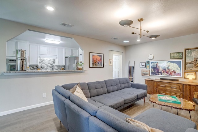 6325 Wallingford Dr, Fort Worth, TX 76133 - living area featuring wood finished floors, baseboards, and recessed lighting