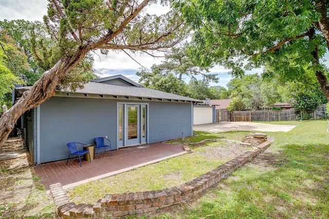 6325 Wallingford Dr, Fort Worth, TX 76133 - back of property featuring a patio and roof with shingles