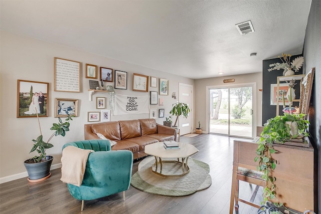 6325 Wallingford Dr, Fort Worth, TX 76133 - living area with wood finished floors, baseboards, and a textured ceiling