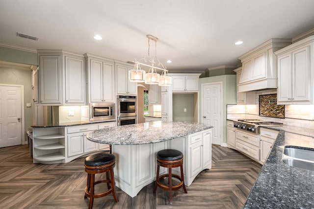 10205 Fairway Vista Dr, Rowlett, TX 75089 - kitchen featuring stainless steel appliances, open shelves, recessed lighting, dark stone countertops, and a kitchen island