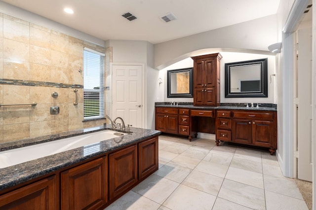 10205 Fairway Vista Dr, Rowlett, TX 75089 - full bath featuring double vanity, a bath, tile patterned flooring, and recessed lighting