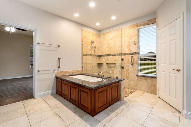 10205 Fairway Vista Dr, Rowlett, TX 75089 - bathroom featuring walk in shower, recessed lighting, and a tub