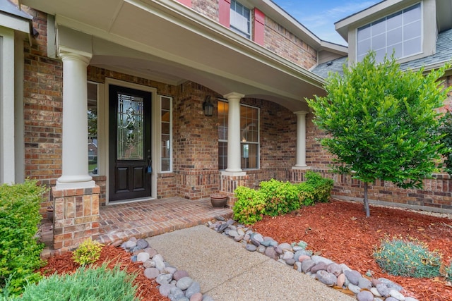 10205 Fairway Vista Dr, Rowlett, TX 75089 - property entrance with a porch and brick siding