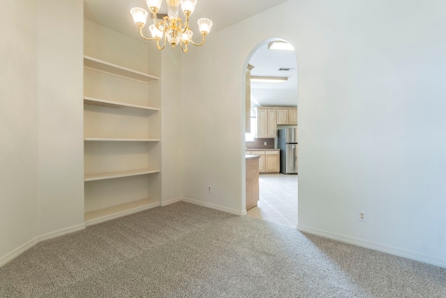 3528 Whitney Way, Hurst, TX 76054 - unfurnished room with light carpet, arched walkways, a chandelier, and baseboards