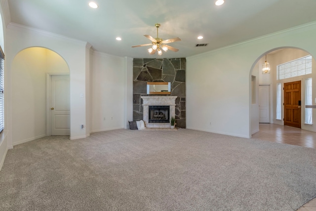 3528 Whitney Way, Hurst, TX 76054 - unfurnished living room with arched walkways, crown molding, ceiling fan, carpet floors, and recessed lighting
