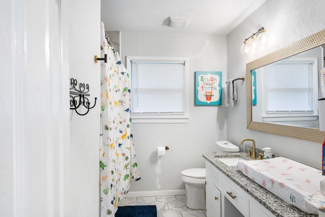 7017 Robinhood Ln, Fort Worth, TX 76112 - full bathroom featuring vanity, toilet, baseboards, a shower with curtain, and tile patterned floors