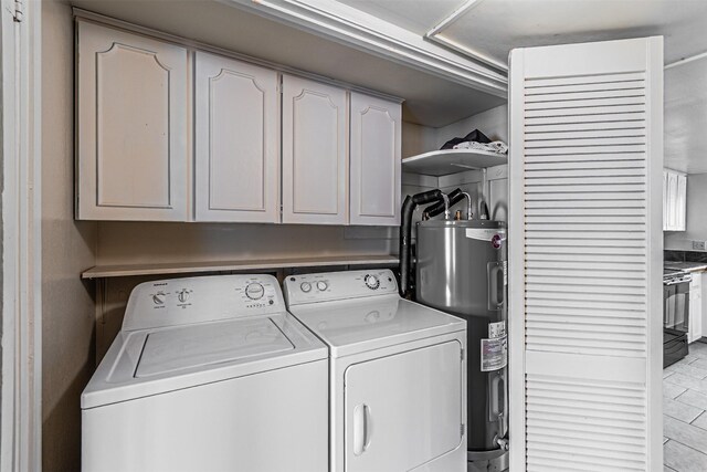 3626 Holly Tree Trl, Garland, TX 75044 - laundry room with independent washer and dryer, electric water heater, and cabinet space