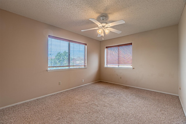 3626 Holly Tree Trl, Garland, TX 75044 - spare room featuring carpet floors, a ceiling fan, a textured ceiling, and baseboards