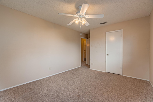 3626 Holly Tree Trl, Garland, TX 75044 - unfurnished bedroom with carpet floors, baseboards, a ceiling fan, and a textured ceiling
