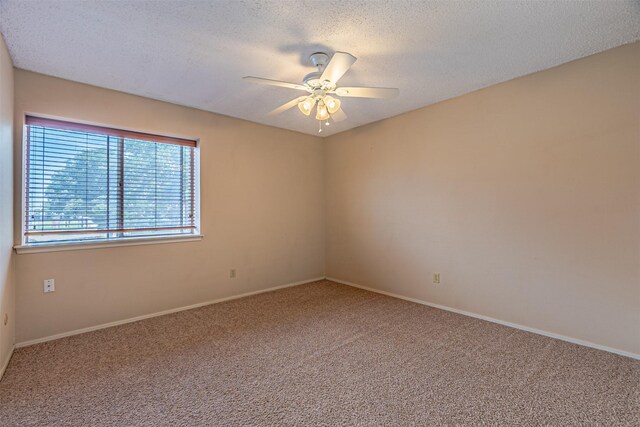 3626 Holly Tree Trl, Garland, TX 75044 - carpeted empty room featuring a ceiling fan, a textured ceiling, and baseboards