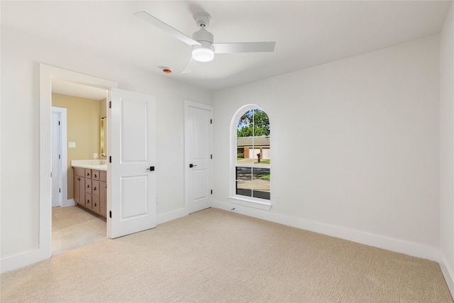 15616 Terrace Lawn Cir, Dallas, TX 75248 - unfurnished bedroom with light carpet, baseboards, ensuite bath, and ceiling fan
