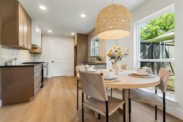 15616 Terrace Lawn Cir, Dallas, TX 75248 - dining area featuring light wood-style flooring, recessed lighting, healthy amount of natural light, and baseboards