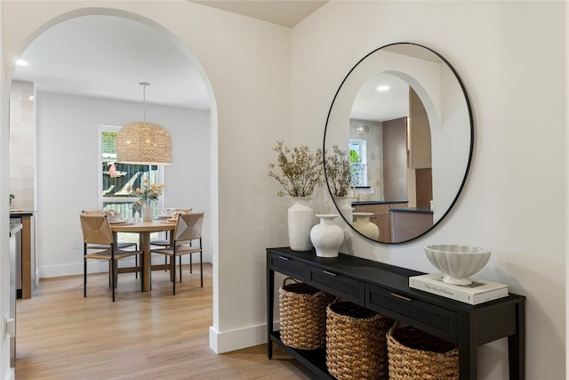 15616 Terrace Lawn Cir, Dallas, TX 75248 - hallway with arched walkways, light wood-type flooring, baseboards, and recessed lighting