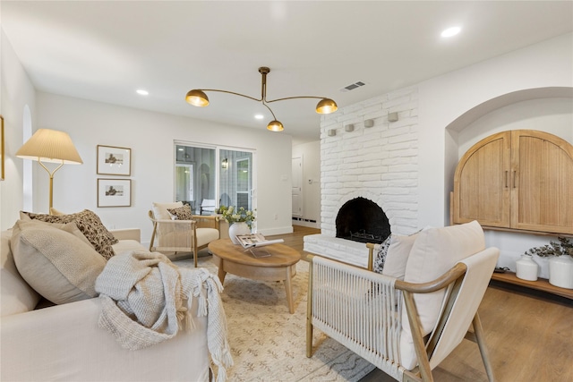 15616 Terrace Lawn Cir, Dallas, TX 75248 - living room with light wood-style flooring, recessed lighting, and a fireplace