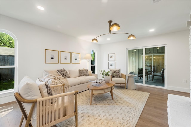 15616 Terrace Lawn Cir, Dallas, TX 75248 - living room with wood finished floors, recessed lighting, and baseboards