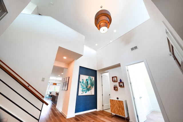 3711 Pistol Creek Dr, Frisco, TX 75034 - foyer with light wood-style flooring, a towering ceiling, stairway, baseboards, and recessed lighting