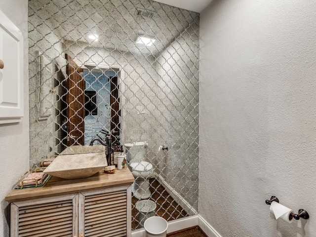 4432 Willow Ln, Dallas, TX 75244 - bathroom with vanity, baseboards, and toilet