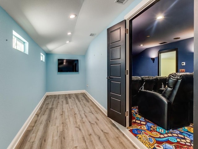 4432 Willow Ln, Dallas, TX 75244 - home theater with light wood-style flooring, vaulted ceiling, baseboards, and recessed lighting