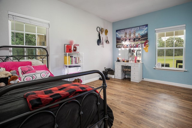 632 County Road 1952, Yantis, TX 75497 - bedroom featuring wood finished floors and baseboards