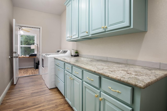 632 County Road 1952, Yantis, TX 75497 - laundry room with washer and clothes dryer, dark wood-style floors, cabinet space, baseboards, and ceiling fan