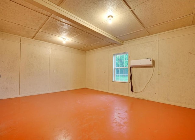 632 County Road 1952, Yantis, TX 75497 - below grade area featuring a decorative wall, a drop ceiling, and an AC wall unit