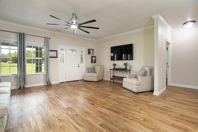 632 County Road 1952, Yantis, TX 75497 - living room featuring crown molding, a ceiling fan, light wood-type flooring, and baseboards