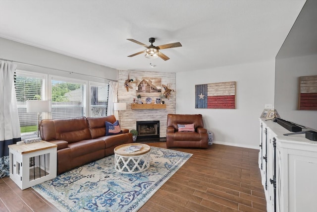 2304 Ranch House Dr, Denton, TX 76210 - living room with a ceiling fan, baseboards, a large fireplace, and dark wood finished floors