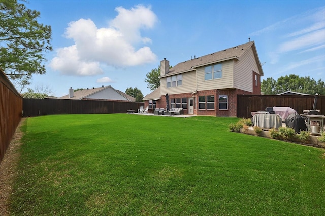 2304 Ranch House Dr, Denton, TX 76210 - back of property featuring brick siding, a patio area, a chimney, and outdoor lounge area