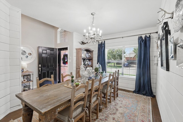 2304 Ranch House Dr, Denton, TX 76210 - dining room with a chandelier, wood finished floors, and crown molding